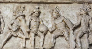 雕刻的古代石浮雕，展現身穿盔甲的戰士在戰鬥中。
