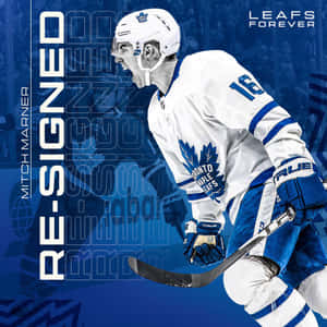 冰球運動員 Mitch Marner 身穿多倫多楓葉隊制服，手持球棍慶祝。