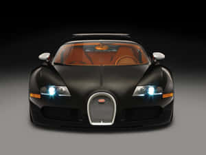 黑色Bugatti Veyron，橙色內飾和發光頭燈，在攝影棚燈光下。