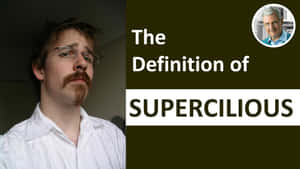 戴眼鏡和鬍子的男人，旁邊有supercilious文字的定義。