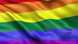 一面飄揚的彩虹旗，帶有鮮豔的條紋，象徵 LGBTQ 驕傲。