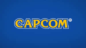 藍色背景上黃色帶白色輪廓的 Capcom 標誌 — 超級英雄 壁紙