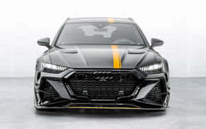黑色奧迪RS6 Avant在白色磚牆工作室中帶有黃色賽車條紋。