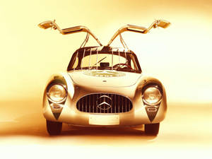 復古平治300 SL，鷗翼車門打開，金色工作室燈光。 — 平治 C300 壁紙