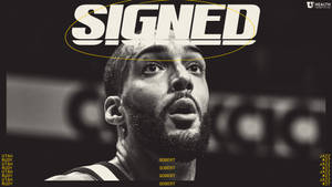 身穿簽名球衣的籃球運動員Rudy Gobert，頭頂有粗體文字。 — 猶他爵士 壁紙