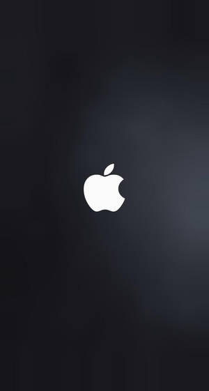 白色Apple標誌在深色漸變背景上帶柔和光暈