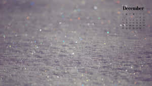 十二月日曆在閃爍的雪背景上。 — 天際線 壁紙