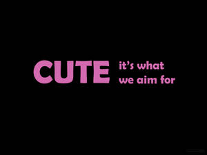 粉紅色文字寫著「CUTE it's what we aim for」在黑色背景上 — 語錄 壁紙