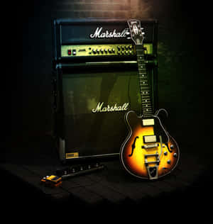 復古旭日紋結他和 Marshall 擴音器在黑暗錄音室的木地板上。