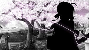 城市公園中櫻花樹下戴著耳機的女孩剪影。