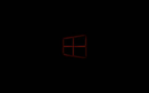 黑色背景上的紅色發光Windows標誌。