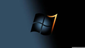 Windows 7 標誌在深藍色漸變背景上帶有金色高光。