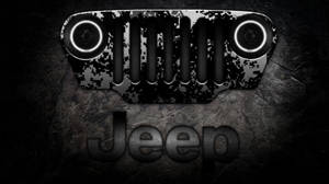在深色石頭表面上的Jeep格柵，帶有發光的頭燈。