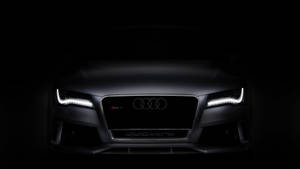 奧迪R8正面視圖，頭燈在黑暗中發光。 — Audi R8 GIF 壁紙