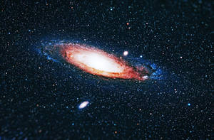 一個螺旋星系，帶有發光的旋臂和散落在深空中的星星。