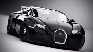 黑色Bugatti Veyron跑車在攝影棚燈光下帶有金色飾邊 — 汽車 壁紙