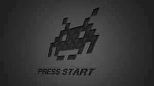 像素外星飛船帶有 press start 文字在深色紋理背景上