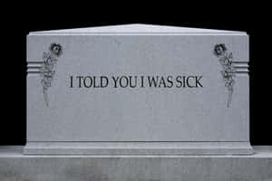 刻有玫瑰圖案和文字「I TOLD YOU I WAS SICK」的灰色墓碑。 — Surface Pro 壁紙