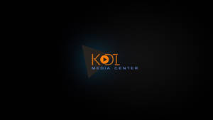 KOI Media Center 標誌，在深色背景上帶有橙色和藍色文字。