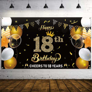 黑色和金色的18歲生日橫幅，磚牆上掛有氣球和五彩紙屑。