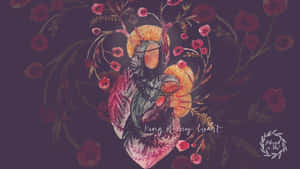 一個戴著皇冠的人物被花卉擁抱，文字為 king of my heart。 — 桌面美學 壁紙